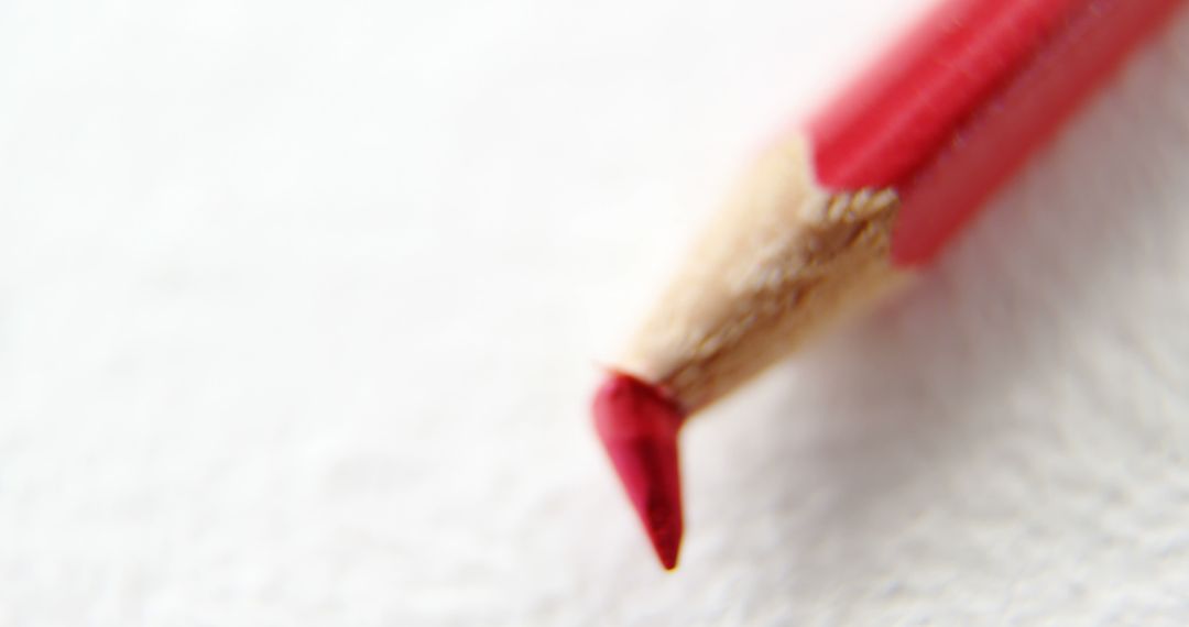 A red pencil with a sharp tip exemplifies precision for detail-oriented artists and writers. - Free Images, Stock Photos and Pictures on Pikwizard.com