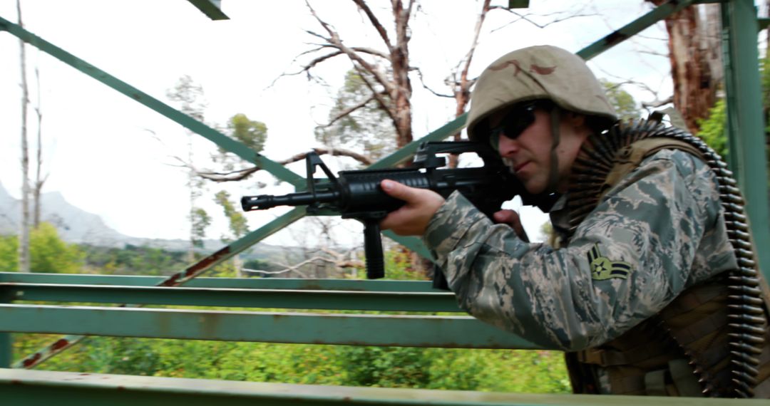 Military Soldier Aiming Rifle in Forested Area - Free Images, Stock Photos and Pictures on Pikwizard.com