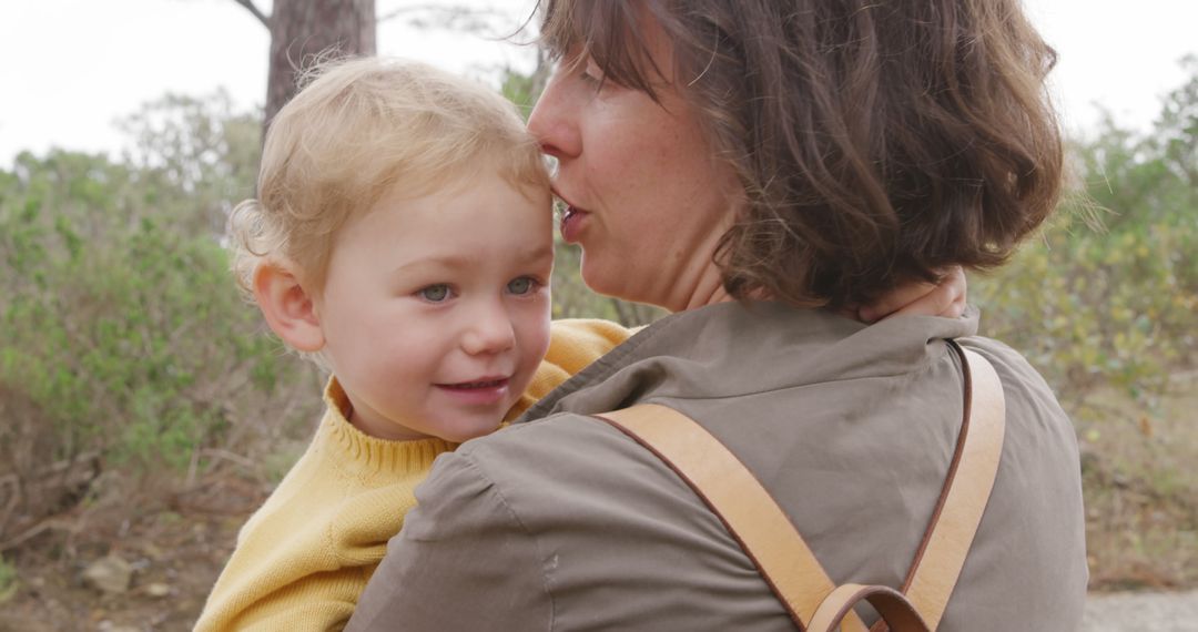 Mother Hugging Toddler Outdoors in Park - Free Images, Stock Photos and Pictures on Pikwizard.com