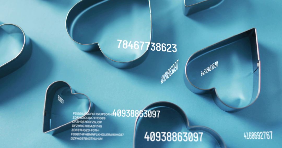 Resting Metal Heart Cookie Cutters Featuring Floating Numeric Overlays on Blue Flatlay