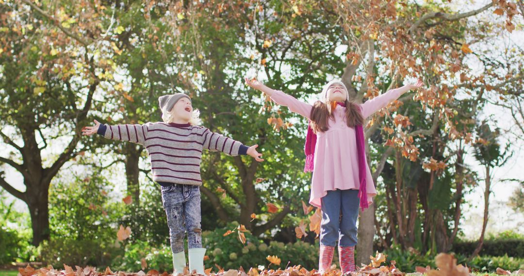 Happy Children Playing in Autumn Leaves in Park - Free Images, Stock Photos and Pictures on Pikwizard.com