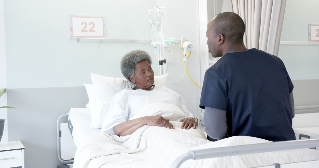 Hospital Nurse Comforting Senior Patient in Hospital Bed - Free Images, Stock Photos and Pictures on Pikwizard.com