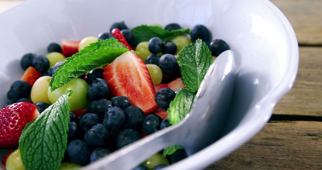 Fresh Fruit Salad with Mint Leaves in White Bowl - Free Images, Stock Photos and Pictures on Pikwizard.com