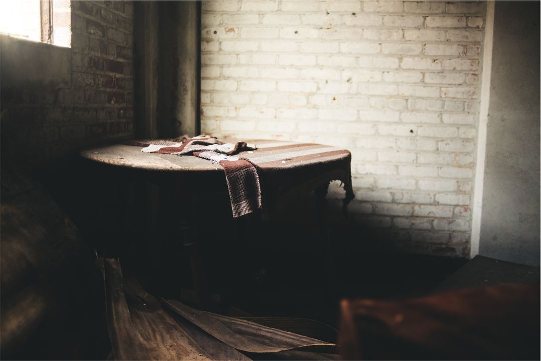 Abandoned Rustic Room with Vintage Table in Soft Lighting - Free Images, Stock Photos and Pictures on Pikwizard.com