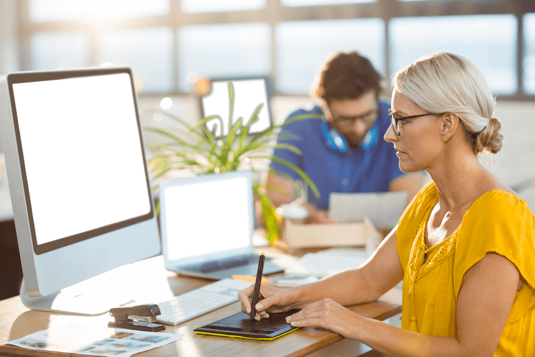 Creative Team Focusing on Digital Illustration in Transparent Workspace