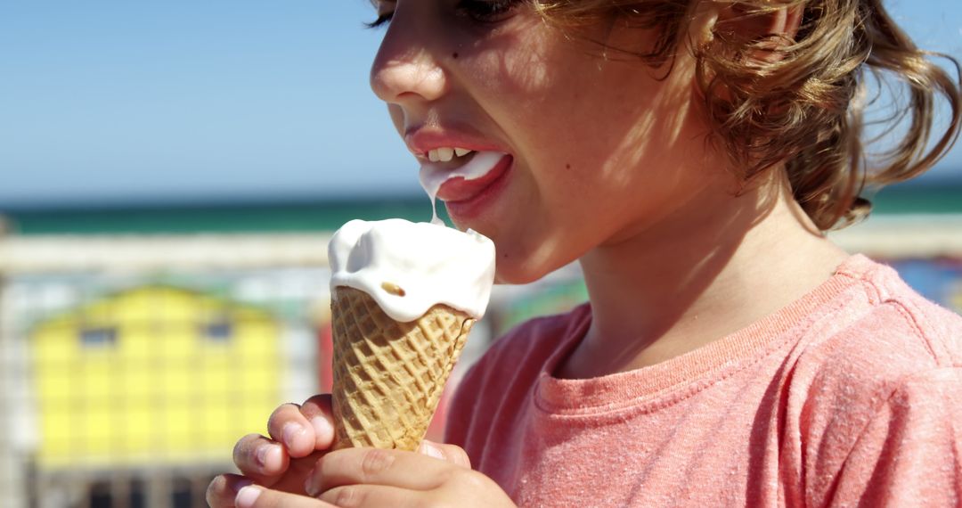 Child Enjoying Ice Cream on Beach - Free Images, Stock Photos and Pictures on Pikwizard.com