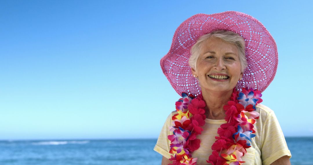 Senior Woman Enjoying Tropical Beach Vacation Smiling brightly - Free Images, Stock Photos and Pictures on Pikwizard.com