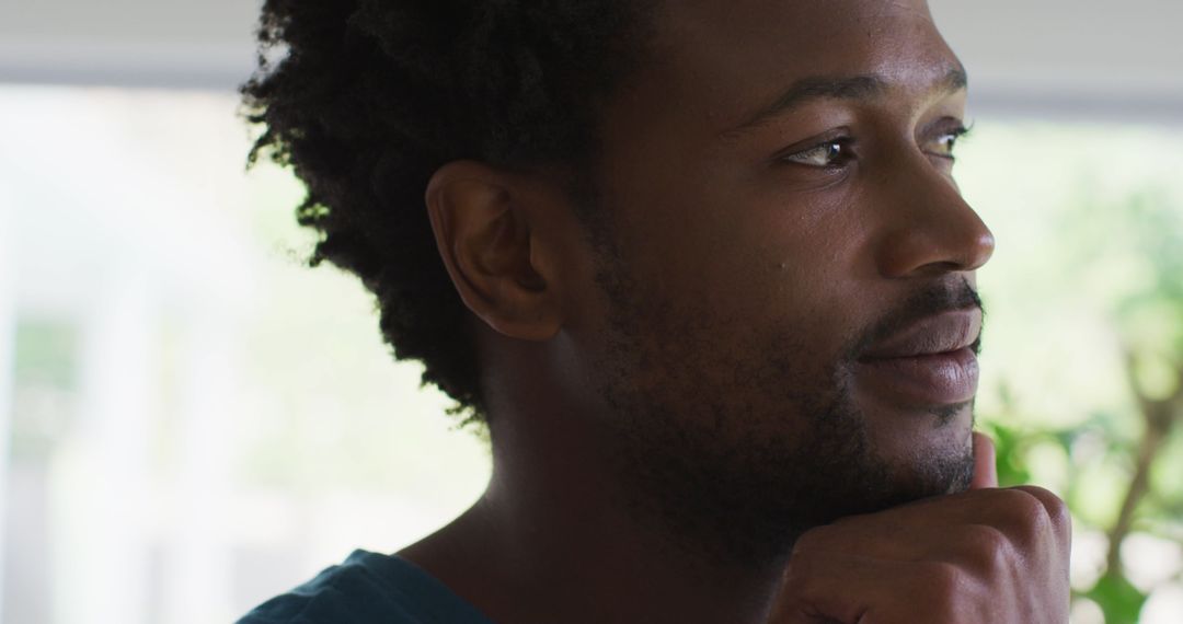 Thoughtful Man Gazing Out Window, Contemplative Indoors
