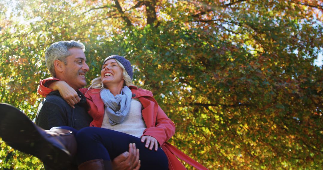 Happy Couple Enjoying Autumn Outdoors Together - Free Images, Stock Photos and Pictures on Pikwizard.com