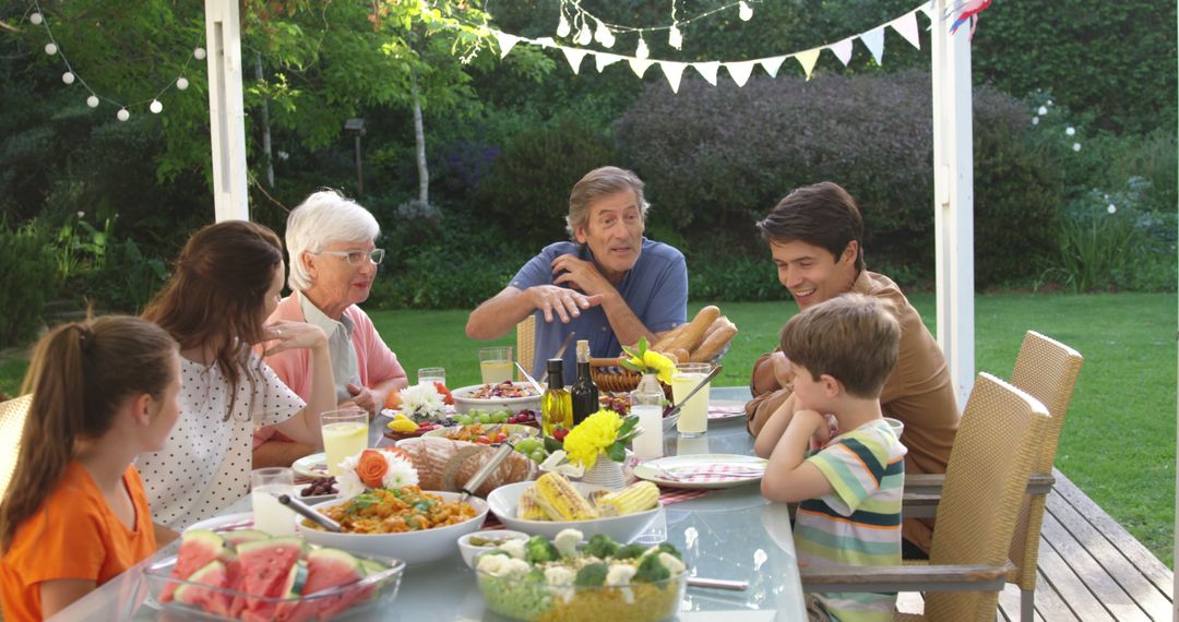 Multi-generational Family Enjoying Outdoor Barbecue Meal Together - Free Images, Stock Photos and Pictures on Pikwizard.com