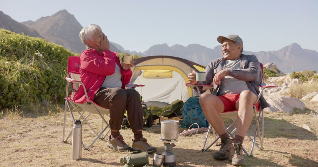 Senior Couple Enjoying Camping with Mountain Views - Free Images, Stock Photos and Pictures on Pikwizard.com