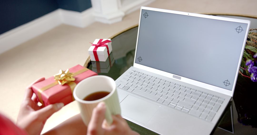 Woman Holding Gift with Laptop Celebrating Virtual Event