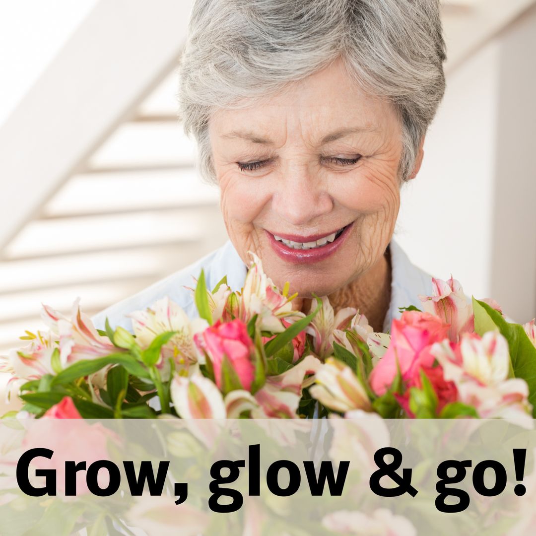 Joyful Senior Woman Holding Colorful Flowers Smiling