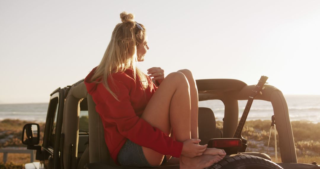 Young Woman Relaxing on Convertible Car at Sunset Near Beach - Free Images, Stock Photos and Pictures on Pikwizard.com