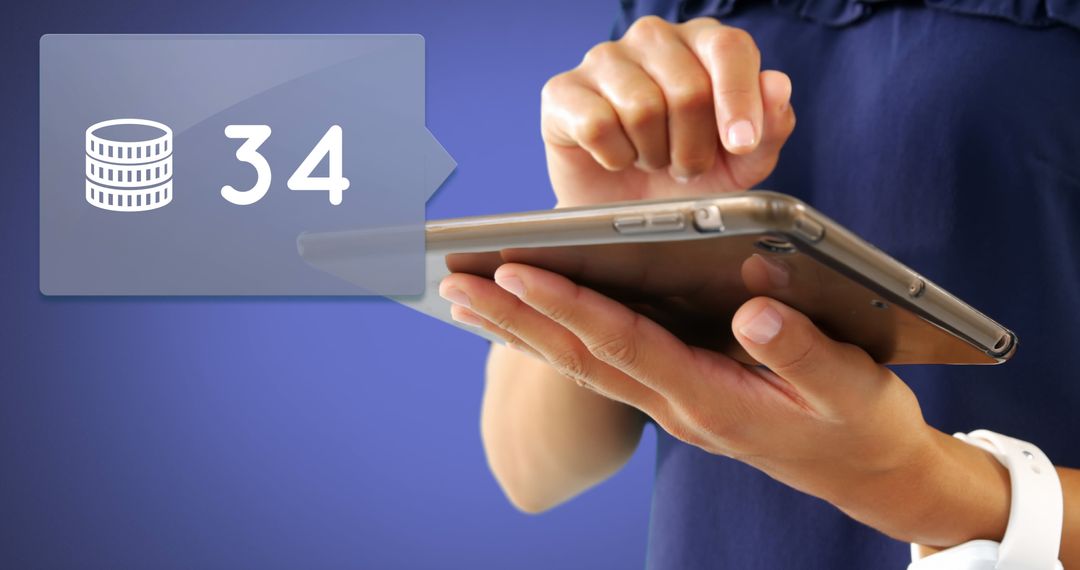 Close-Up of Hands Typing on Tablet with Digital Coin Tracker