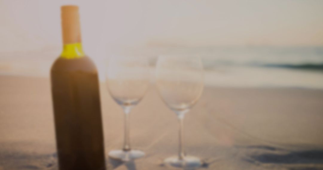 Red Wine Bottle and Glasses on Beach for Elegant Celebration