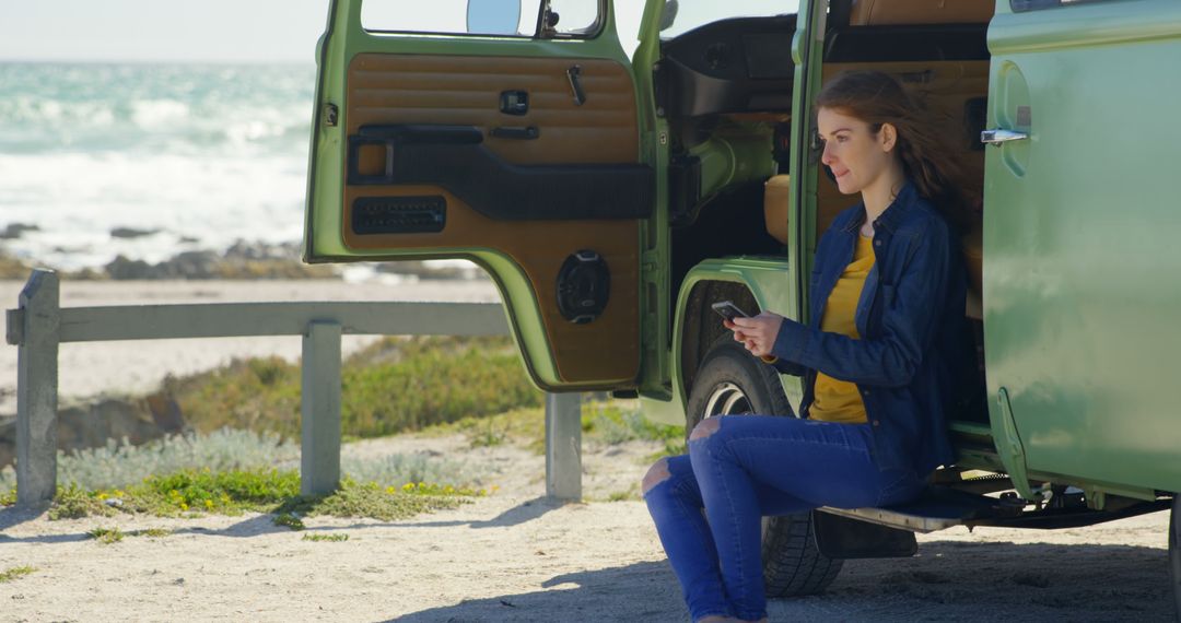 Young Woman Relaxing in Camper Van by Beach - Free Images, Stock Photos and Pictures on Pikwizard.com