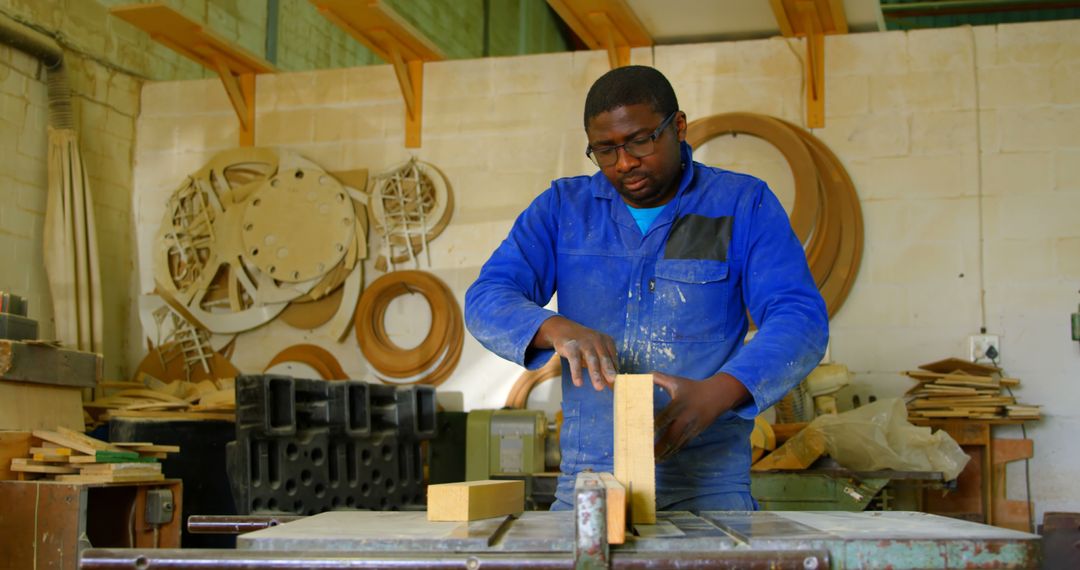 Male Carpenter Working in Workshop, Assembling Wooden Pieces - Free Images, Stock Photos and Pictures on Pikwizard.com