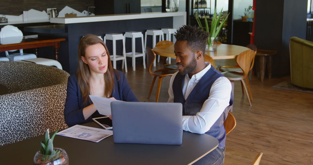 Diverse Coworkers Collaborating in Modern Workspace