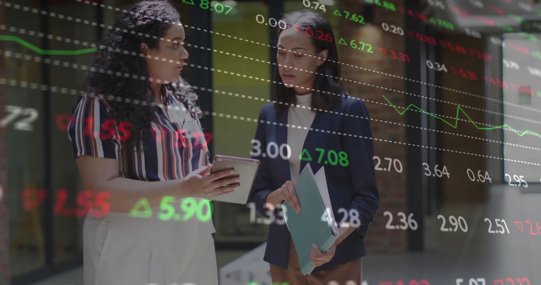 Businesswomen Analyzing Stock Market Data on Tablet and Folder