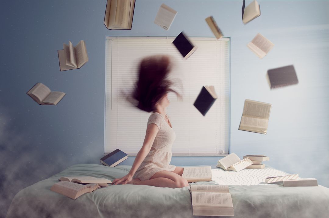 Woman Surrounded by Floating Books in Bedroom - Free Images, Stock Photos and Pictures on Pikwizard.com