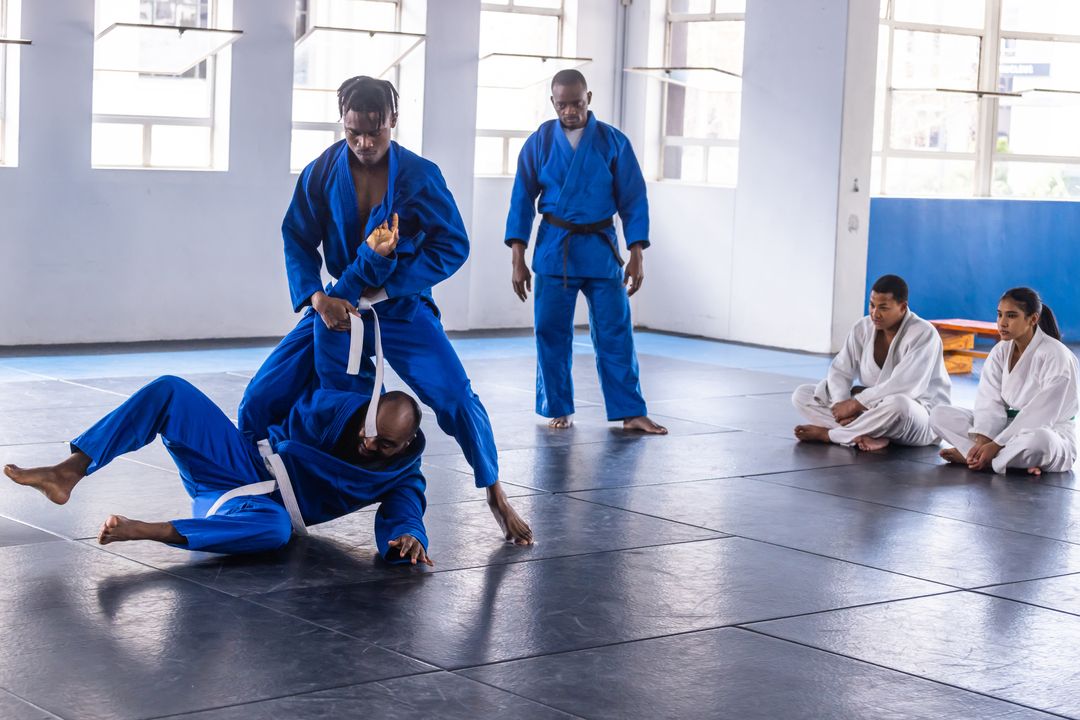 Martial Arts Class Practicing Grappling Techniques in Dojo