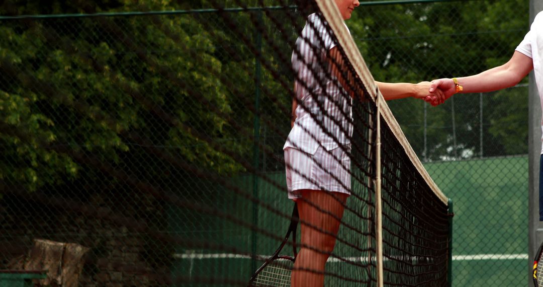 Tennis Players Shaking Hands After Match with Sportsmanship - Free Images, Stock Photos and Pictures on Pikwizard.com