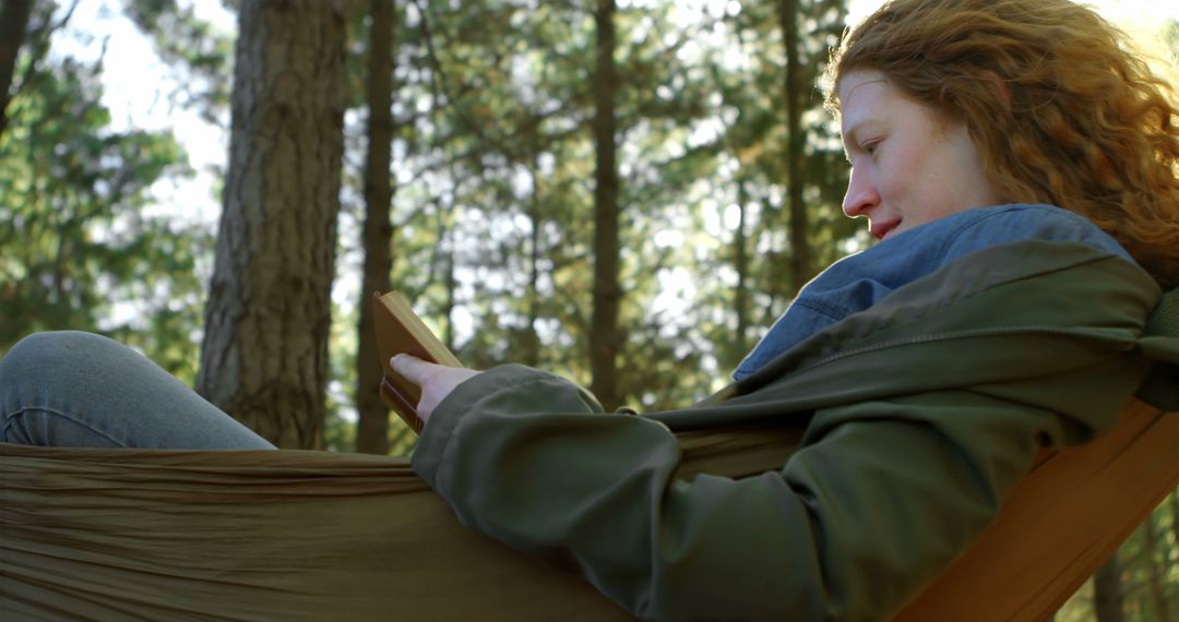 Woman Reading Book in Hammock Outdoors - Free Images, Stock Photos and Pictures on Pikwizard.com