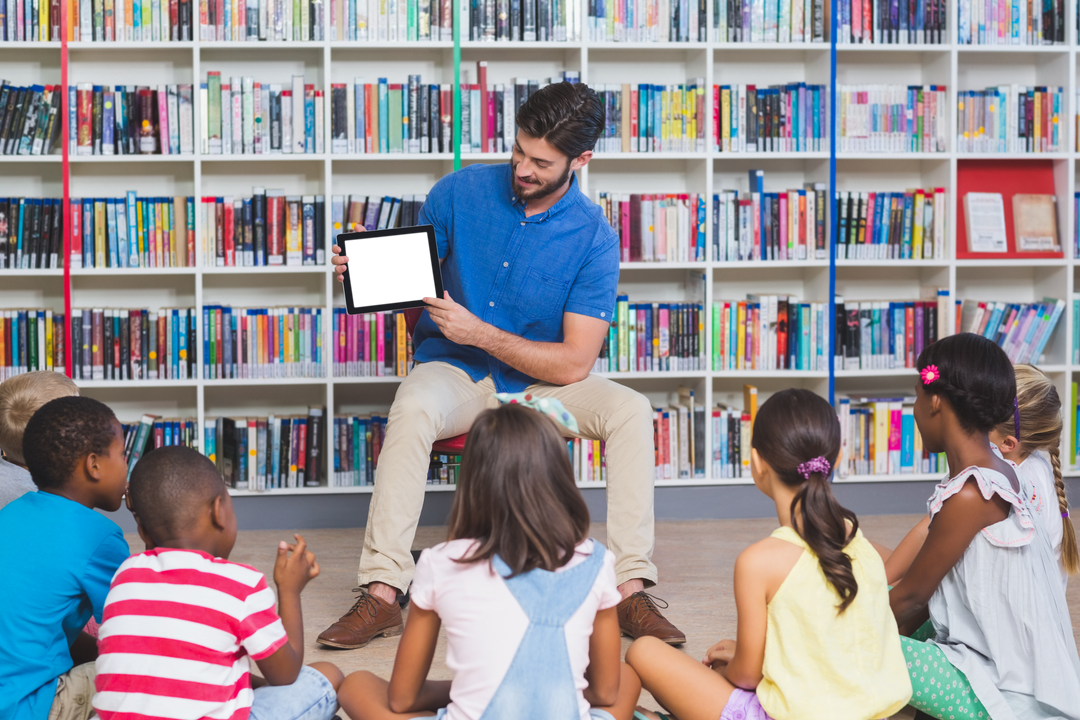 Transparent Teacher Teaching Kids with Digital Tablet in Library at Elementary School - Download Free Stock Images Pikwizard.com