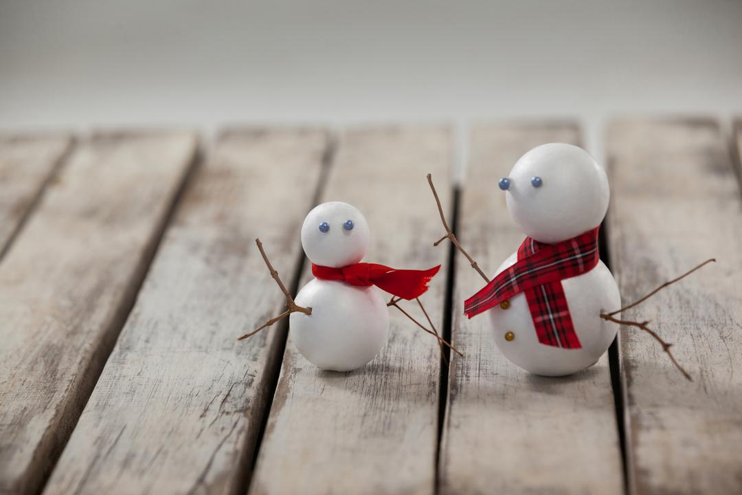 Two snowman on a plank - Free Images, Stock Photos and Pictures on Pikwizard.com