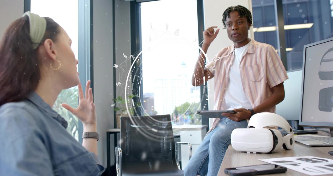 Black man presenting VR concept to colleague in office during tech brainstorming meeting