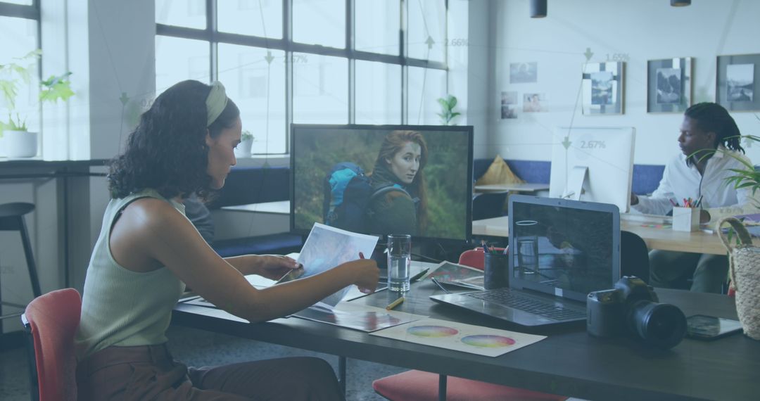 Diverse Team Analyzing Data for Innovative Solutions in Modern Office