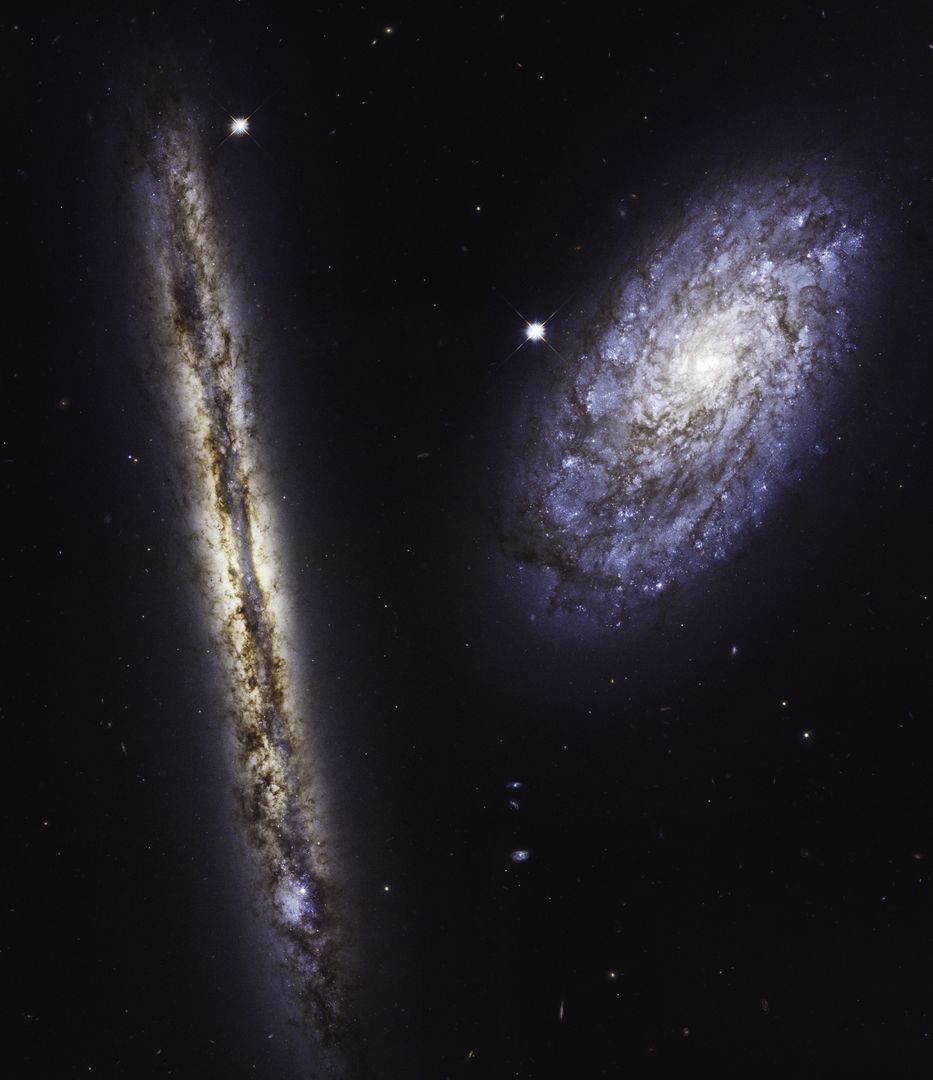 Stunning Pair of Spiral Galaxies NGC 4302 and NGC 4298 Captured by Hubble - Free Images, Stock Photos and Pictures on Pikwizard.com