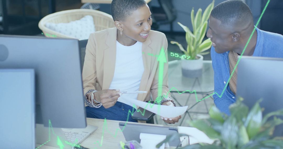 Corporate Team Analyzing Financial Data in Modern Office Space