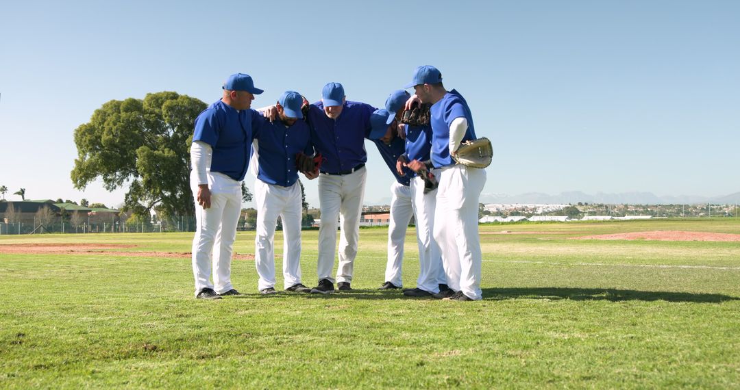 Team Huddle on Field: Baseball Players Unity and Determination