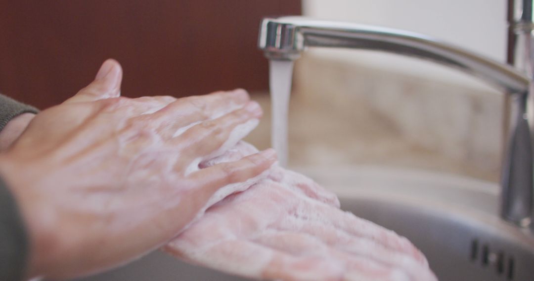 Person Washing Hands with Soap Under Running Water - Free Images, Stock Photos and Pictures on Pikwizard.com