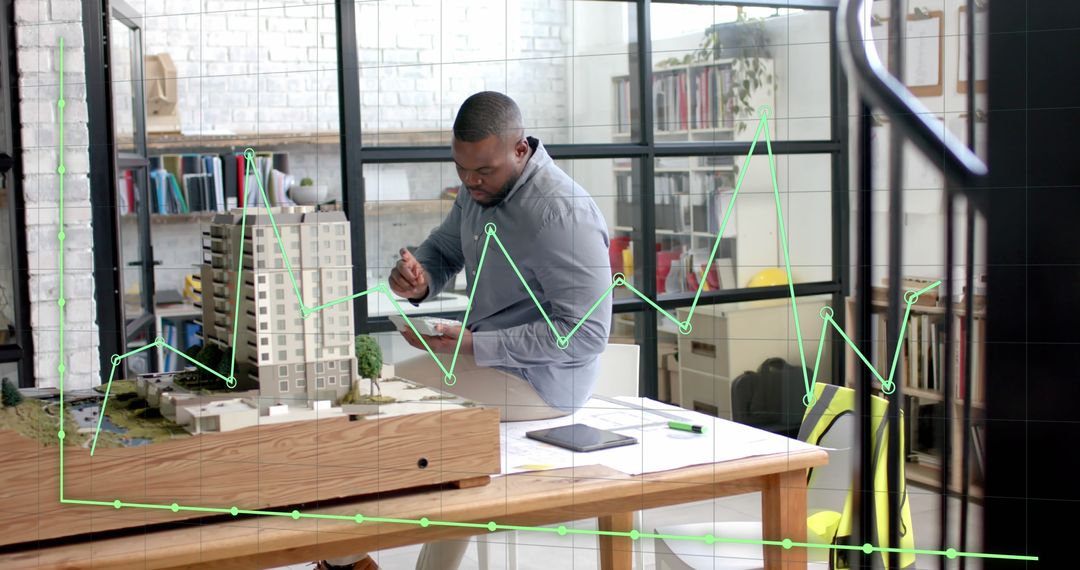African American Architect Analyzing Building Model with Data Overlay