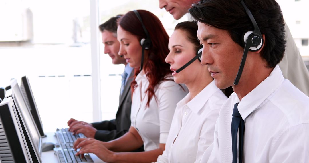 Focused Call Center Team Assisting Customers