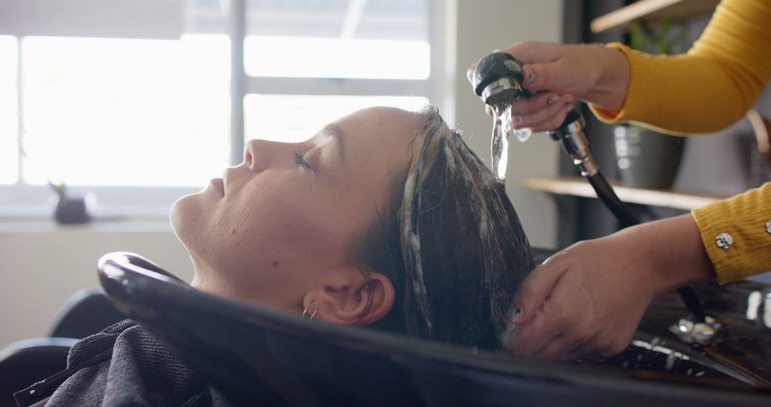 Woman Receiving Hair Wash at Beauty Salon - Free Images, Stock Photos and Pictures on Pikwizard.com