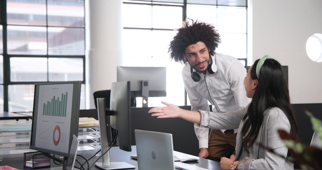 Collaborative Colleagues Discussing Work in Modern Office