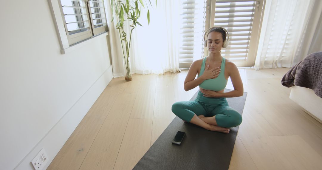 Woman Practicing Mindful Breathing in Relaxing Home Setting