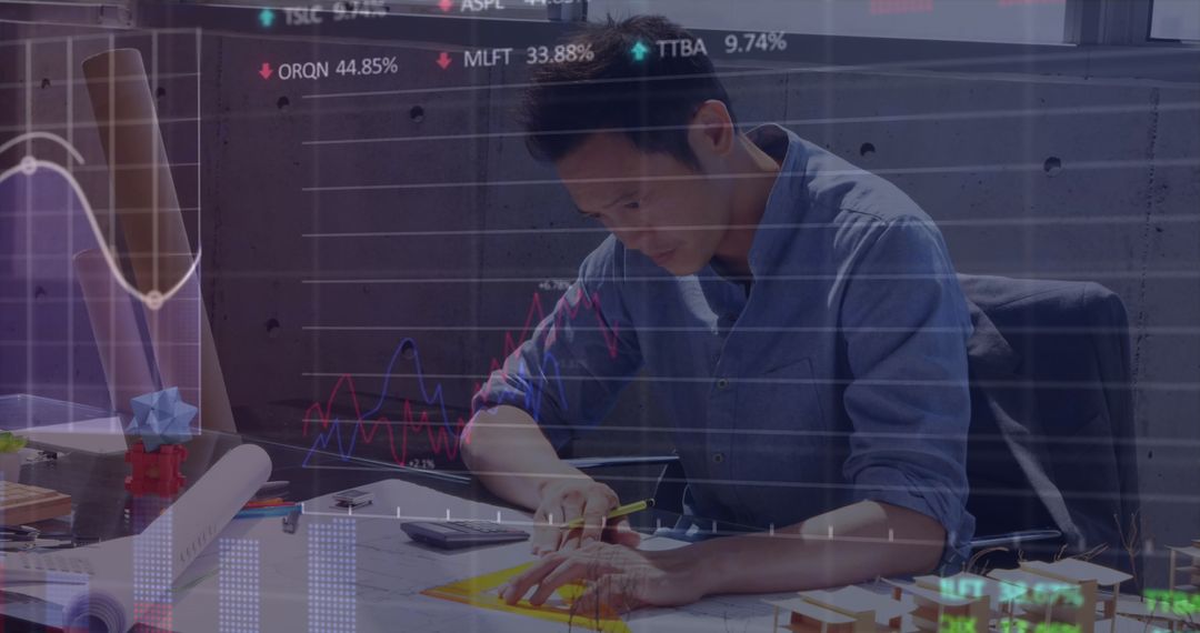 Businessman Analyzing Finances Overlay with Digital Charts
