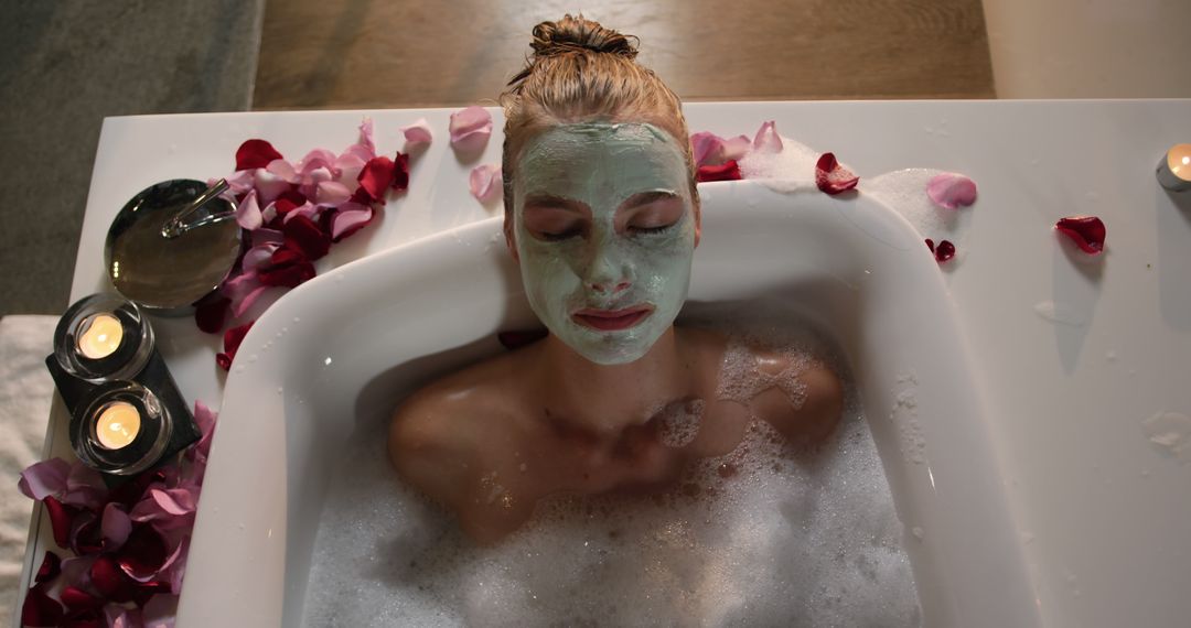 Woman Relaxing in Bubble Bath with Face Mask and Petal Decoration - Free Images, Stock Photos and Pictures on Pikwizard.com