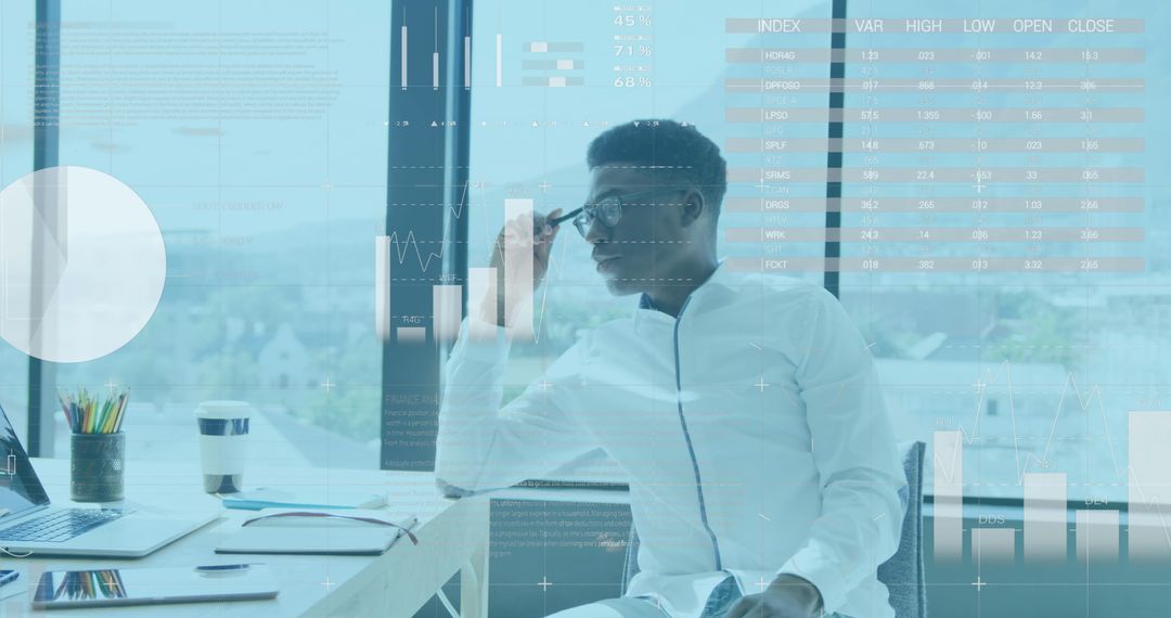 Businessman Analyzing Data and Statistics on Laptop