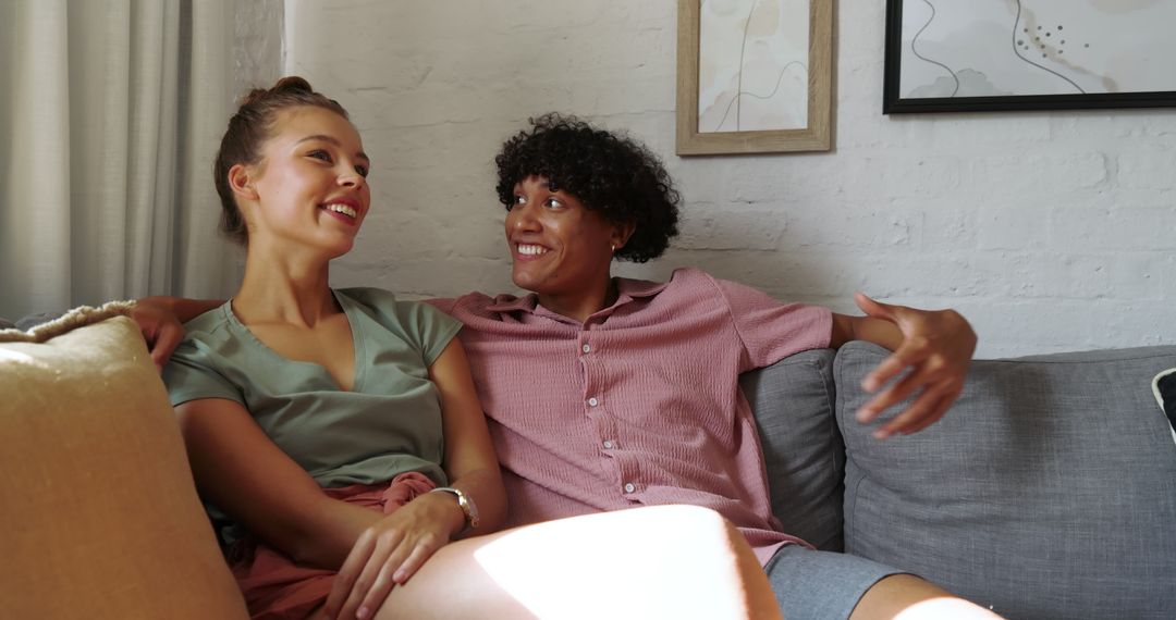 Happy Couple Relaxing on Comfortable Sofa at Home