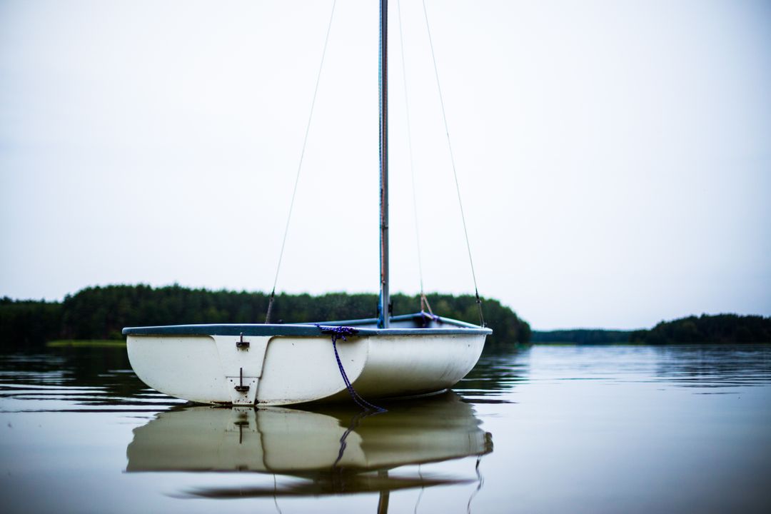 Serene Sailboat in Still Water at Sunset - Free Images, Stock Photos and Pictures on Pikwizard.com
