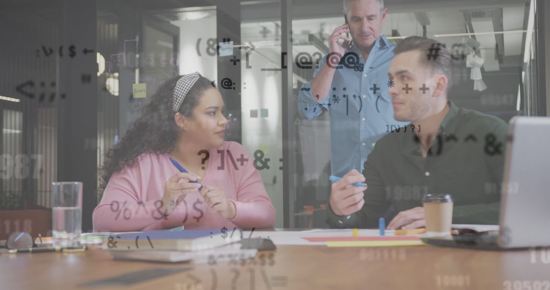 Diverse Team Collaborating on Data Analysis Projects in Office