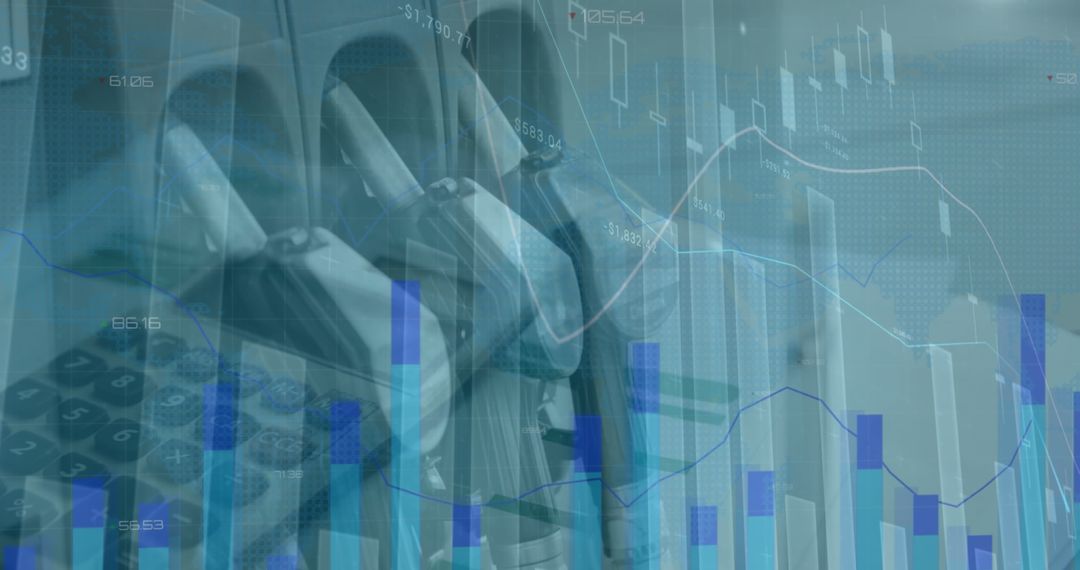 Close-Up of Petrol Nozzles Overlaying Financial Charts and Calculator