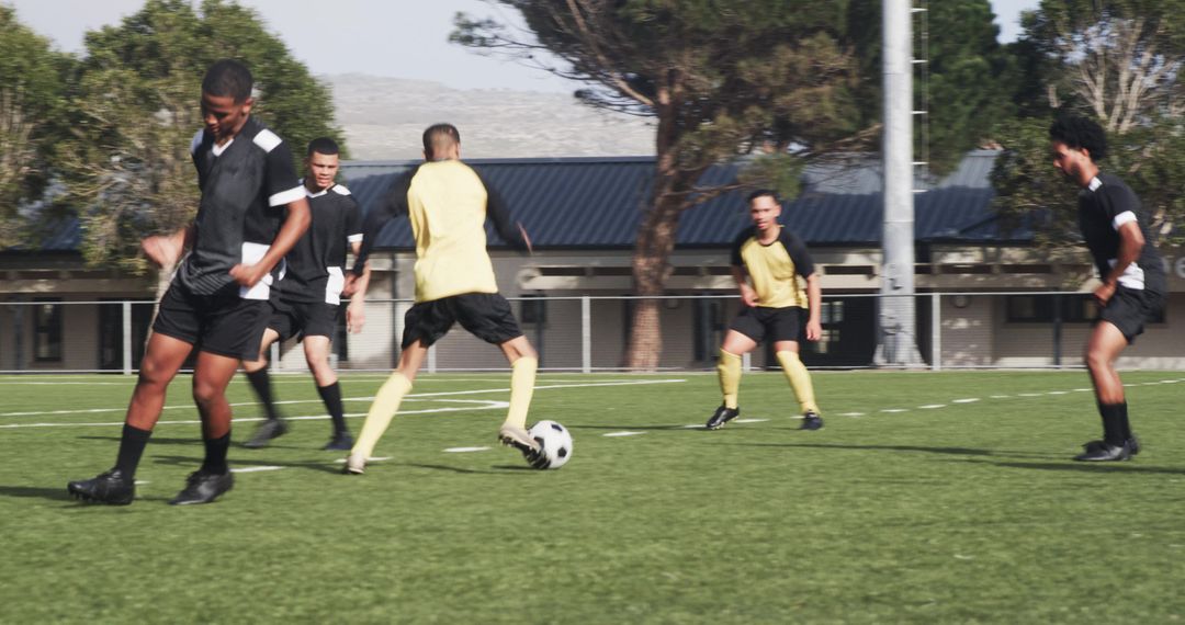 Soccer Players in Action on Field During Training Session