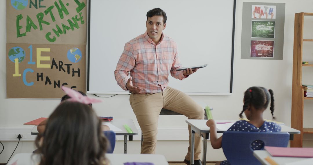 Teacher Enthusiastically Engaging with Students in Classroom - Free Images, Stock Photos and Pictures on Pikwizard.com